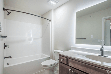 Updated bathroom with tub/shower combo and modern vanity