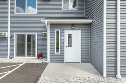 The Arnie Apartments covered parking and entrance