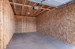 Inside view of the covered garage with parking spaces
