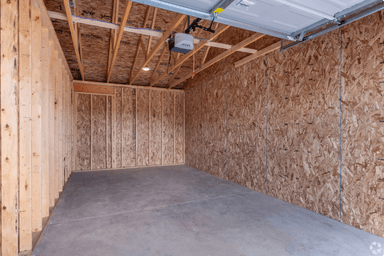 Inside view of the covered garage with parking spaces